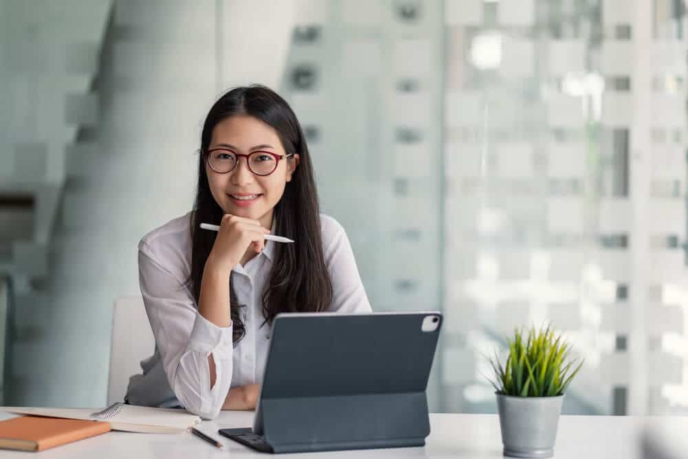 woman sitting at a computer in office